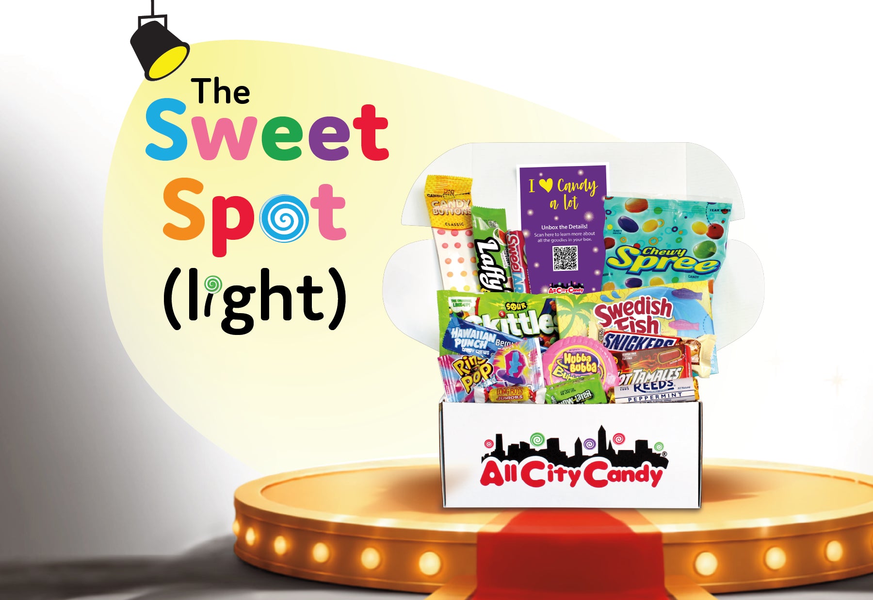 A promotional graphic for 'The Sweet Spot (light)' featuring a box of assorted candies from All City Candy displayed on a glowing circular platform. The box contains various colorful sweets, and the background has a spotlight effect with the text 'The Sweet Spot (light)'.