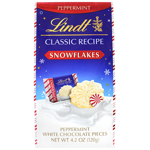 Lindt Peppermint White Chocolate Snowflakes – 4.2 oz. Bag | Holiday Edition - Visit www.allcitycandy.com for great candy, service and delicious treats.